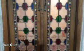 ساخت درب منزل با چوب گردو طرح اسلیمی در اصفهان